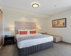 Studio Apartment Bedroom - CBD Luxury Accommodation